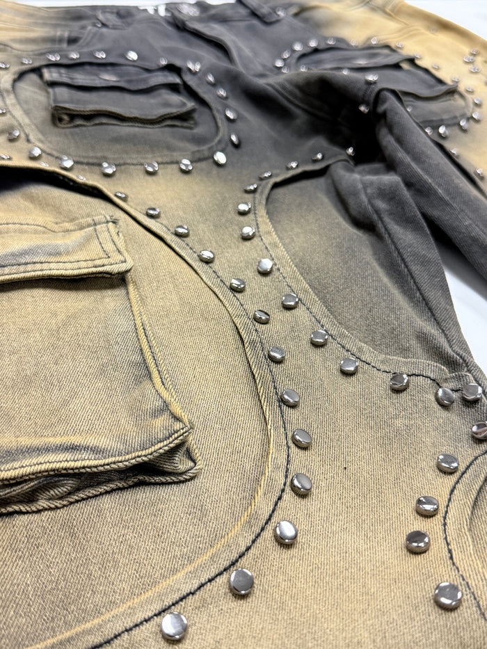Taker Metal Stud Premium Stretch Cargo Jeans in Mud Black, stacked denim style with metal stud accents and functional pockets.