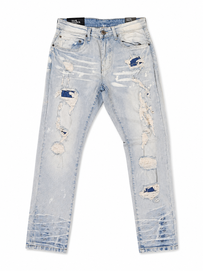 Copper Rivet denim pants with rip and repair details in LSB color, showcasing distressed style and sturdy denim fabric.