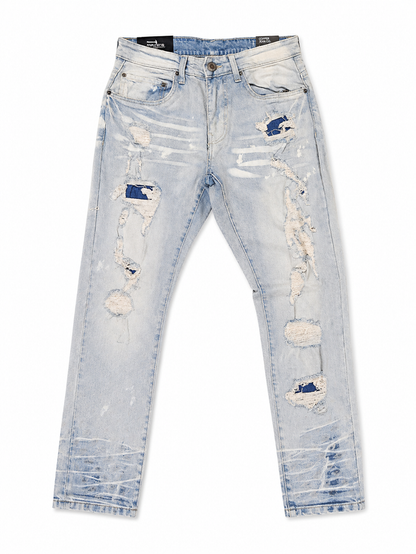 Copper Rivet denim pants with rip and repair details in LSB color, showcasing distressed style and sturdy denim fabric.