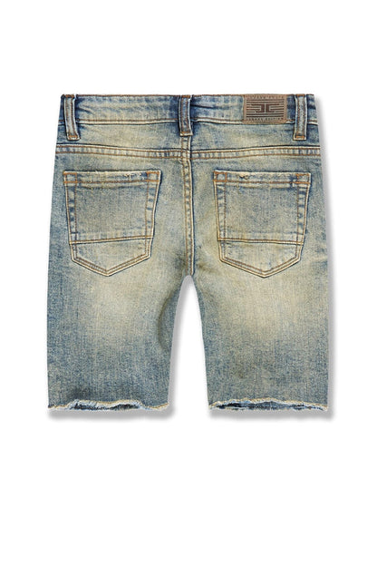 Jordan Craig Kids Arlington denim shorts in desert storm color, showing front view with rolled-up hem and classic five-pocket design.