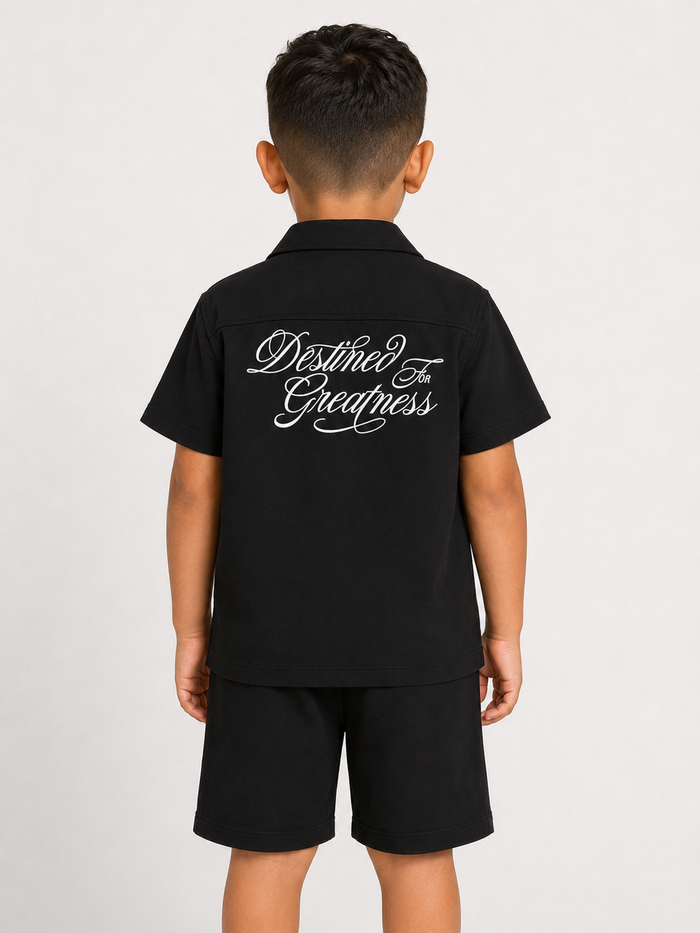 Jordan Craig Kids black short sleeve button-up shirt with collar and chest pocket, perfect for casual kids' style.