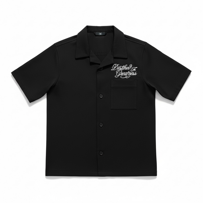 Jordan Craig Kids Greatness Camp black short sleeve button-up shirt, casual kids' tee with collar and button details.