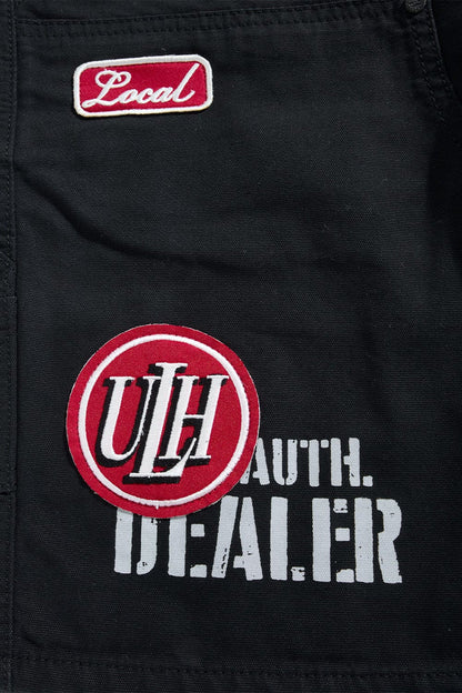 Black Jordan Craig 'Re-Up' shorts with a relaxed fit, featuring the brand's logo on the front, displayed on a plain background.