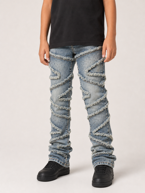 Light wash FWRD Kids Stacked Slash denim jeans with a stylish cut and classic denim texture, perfect for kids.
