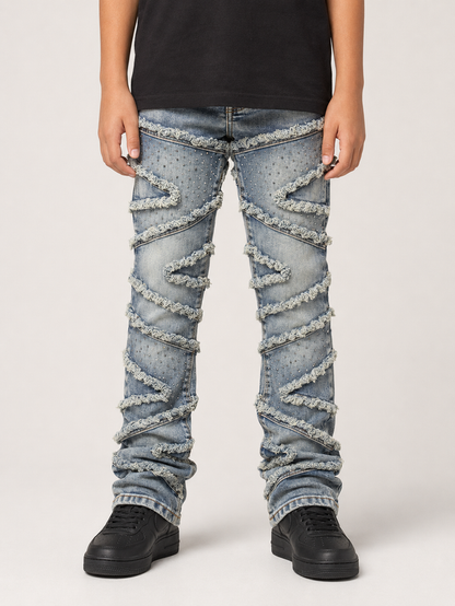 FWRD Kids Stacked Slash denim jeans in light tint, featuring a classic blue denim look with distressed detailing and a relaxed fit.