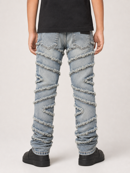 Light tint denim jeans for kids from FWRD KIDS with a stacked slash design, shown in a natural pose.