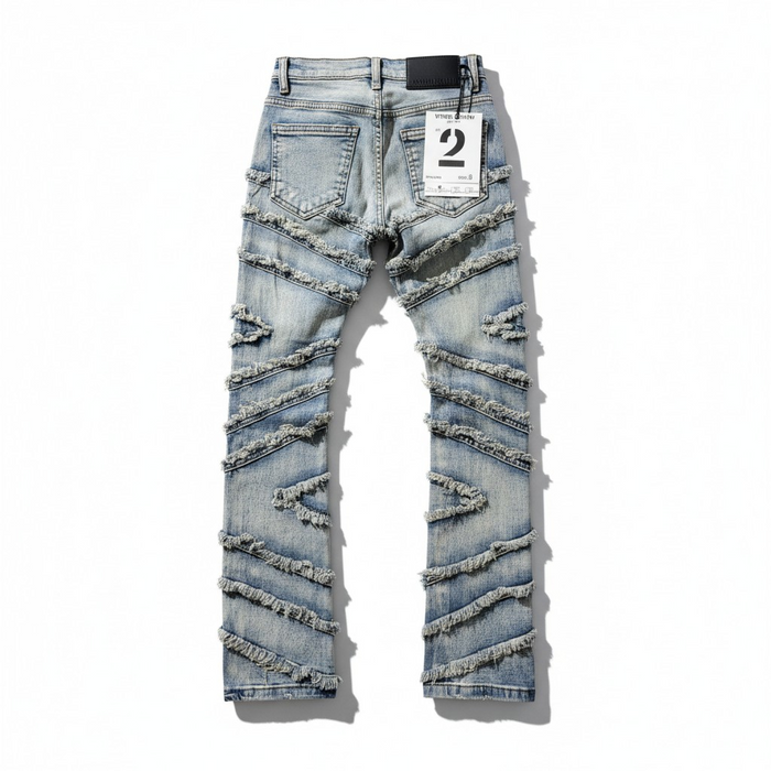FWRD Kids Stacked Slash denim jeans in light tint, showing the front view with stylish distressed details and classic denim texture.