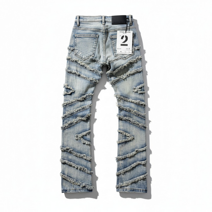 FWRD Kids Stacked Slash denim jeans in light tint, showing the front view with stylish distressed details and classic denim texture.