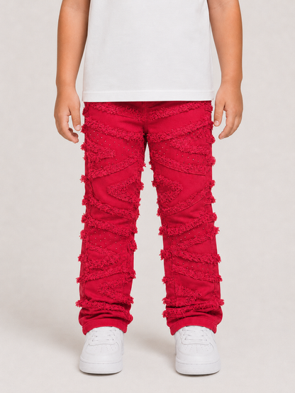 FWRD Kids Stacked Slash Denim jeans in red, featuring a stylish denim design and brand logo, displayed on a white background.