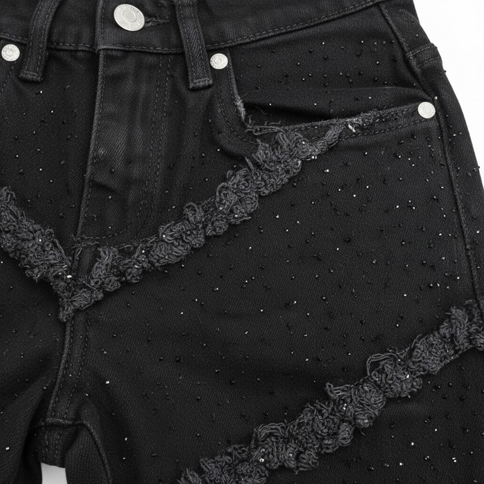 FWRD KIDS Fray Crystal slim straight denim jeans in jet black, showing the denim fabric and frayed ankle details.