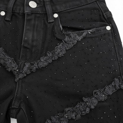 FWRD KIDS Fray Crystal slim straight denim jeans in jet black, showing the denim fabric and frayed ankle details.