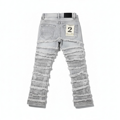 FWRD Kids distressed gray stacked denim jeans with frayed edges and a relaxed fit, featuring a casual, trendy style.