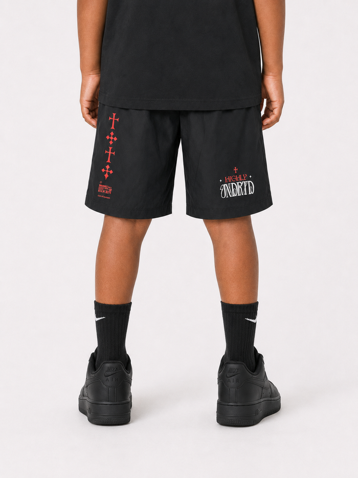 Black and silver kids' shorts from Highly Undrtd Kids' Rise Above collection, featuring a comfortable fit and stylish design.