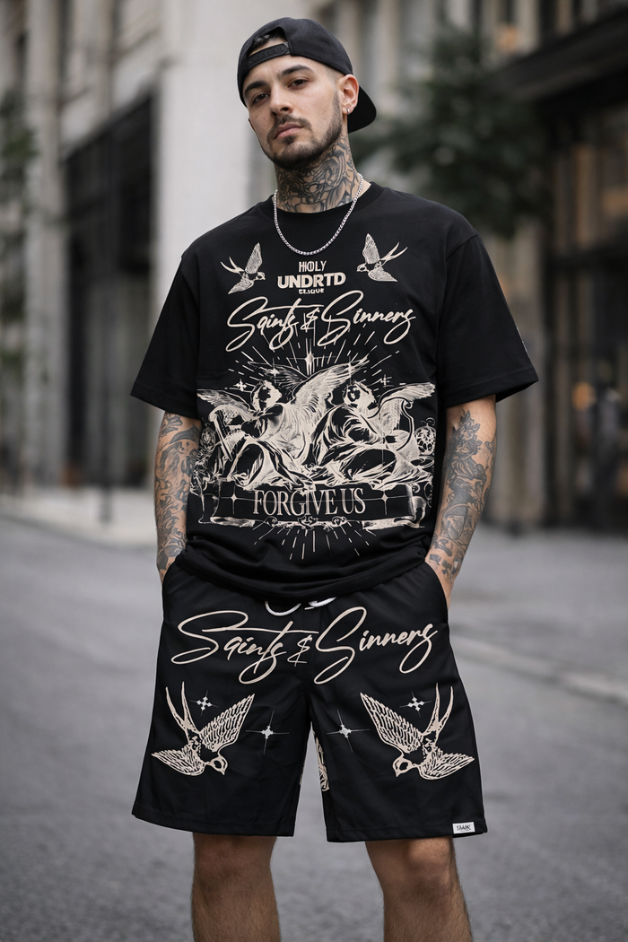 Highly Undrtd Saints & Sinners black shorts featuring a casual fit and bold design, perfect for streetwear or everyday wear.