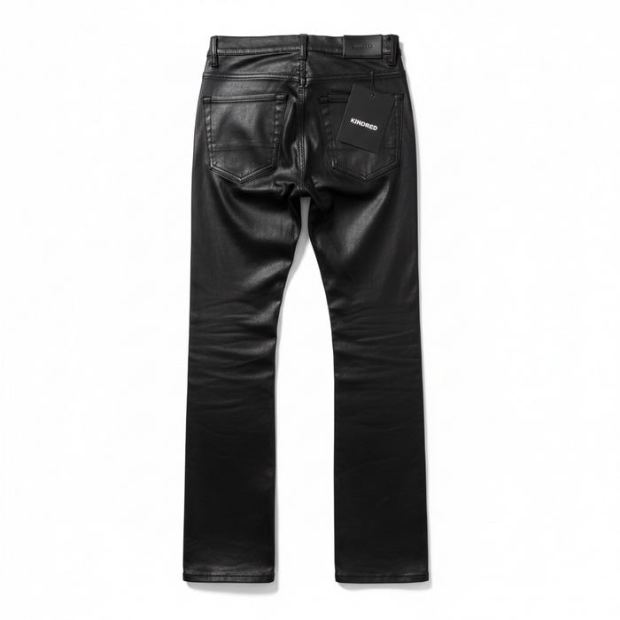 Kindred coated denim studded stacked jeans with metal embellishments, slim fit, and distressed details, designed for a modern casual look.