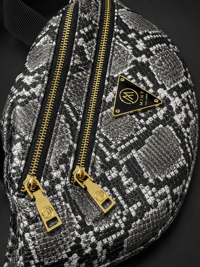 Mint Python Fanny Pack in black and white with cobra design, stylish belt bag featuring a sleek, compact shape and adjustable strap.