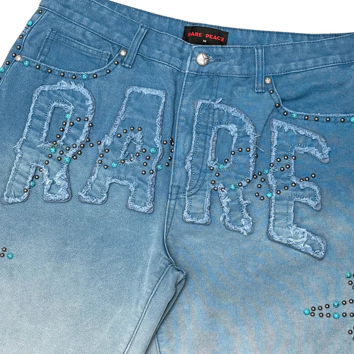 Rare Peace rhinestone denim shorts with patch detail, featuring a distressed design and a light MD tint, stylish and trendy.