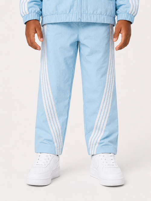 Rebel Minds kids nylon stripe track pants in light blue, comfortable kids' athletic pants with sporty design and elastic waistband.