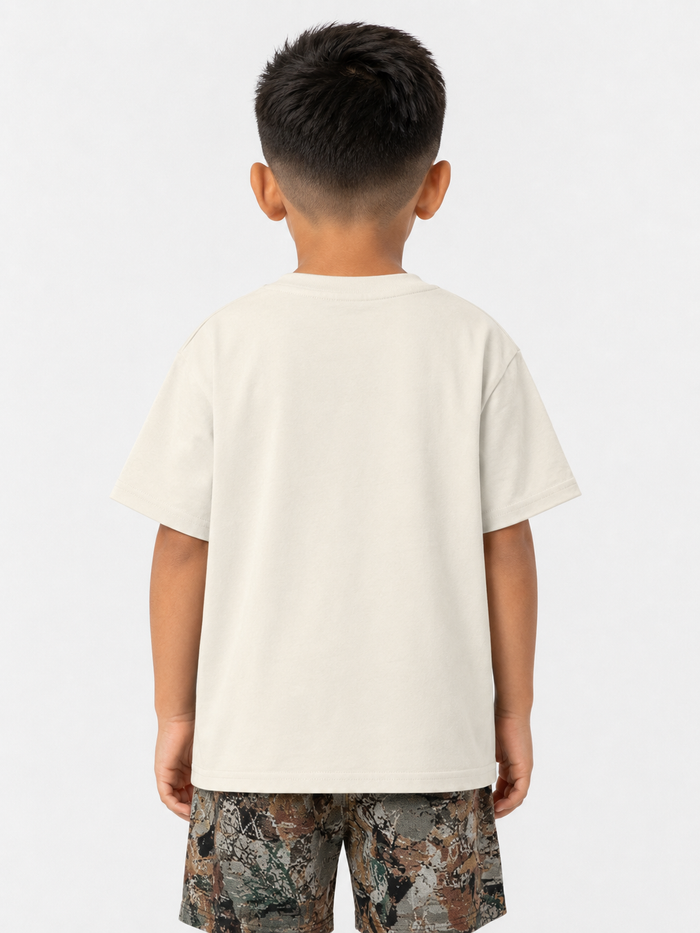 Kids' cream T-shirt from Rebel Minds Kids with vibrant paradise tapestry design, soft cotton fabric, and comfortable fit.