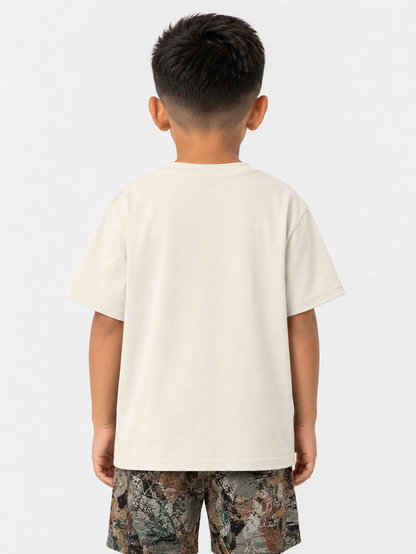 Kids' cream T-shirt from Rebel Minds Kids with vibrant paradise tapestry design, soft cotton fabric, and comfortable fit.