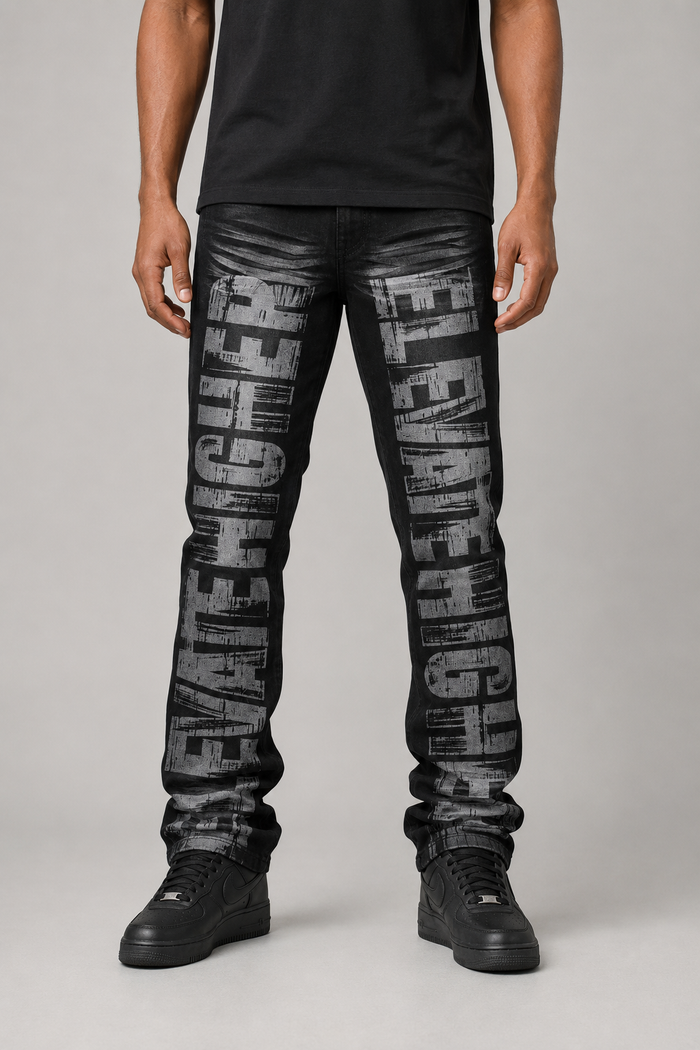 Black Ash Taker all-over print premium stretch stacked denim jeans, showcasing detailed design and texture.