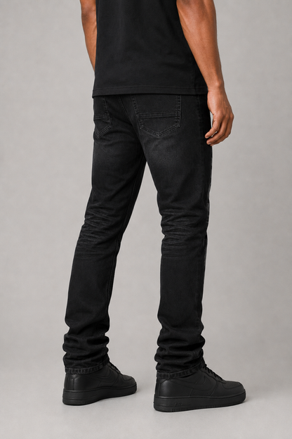 Taker all over print premium stretch stacked denim jeans in black ash, showcasing the detailed design and fabric texture.