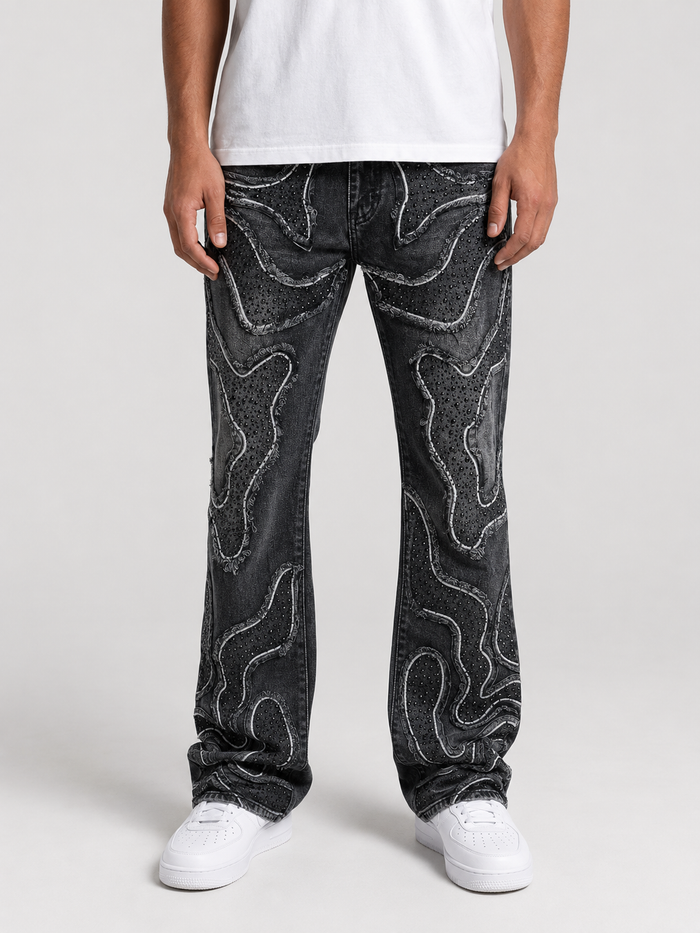 Taker frayed patched premium stretch stacked denim in vintage black, showcasing distressed details and layered design.