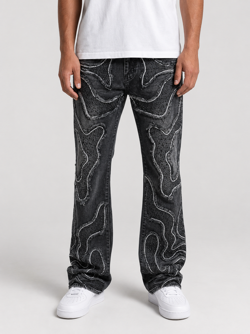 Taker frayed patched premium stretch stacked denim in vintage black, showcasing distressed details and layered design.