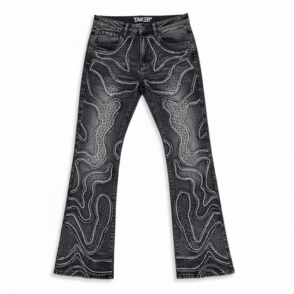 Taker 'Frayed Patched' Premium Stretch Stack Denim in Vintage Black, showing distressed patch details and slim fit design.