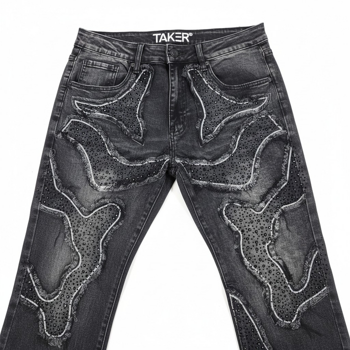 Taker 'Frayed Patched' premium stretch stacked denim jeans in vintage black with distressed and patched details.