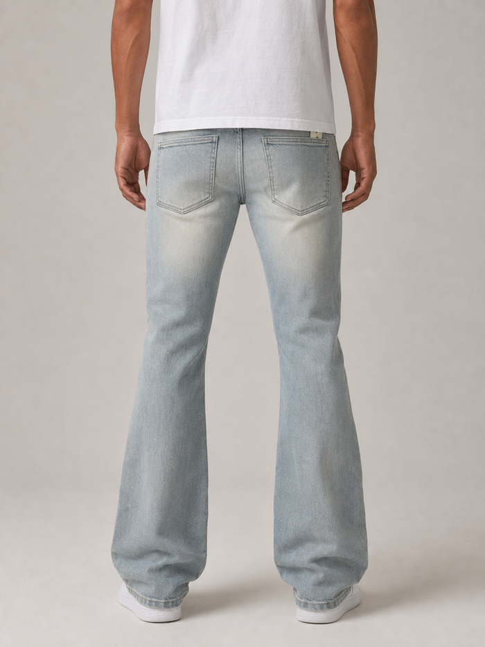 Taker Rhinestone Cross premium stretch stacked denim jeans in rustic blue with rhinestone embellishments and distressed details.