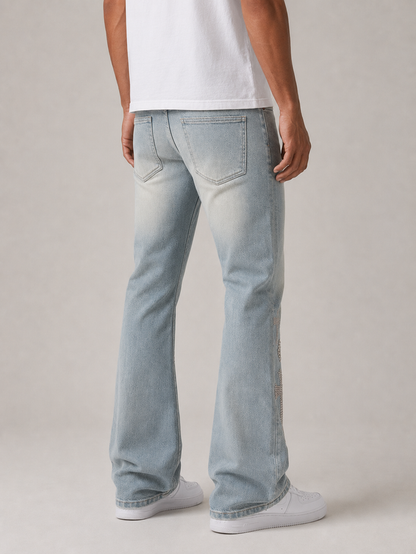 Taker Rhinestone Cross premium stretch stacked denim jeans in rustic blue with rhinestone embellishments and cross detail.