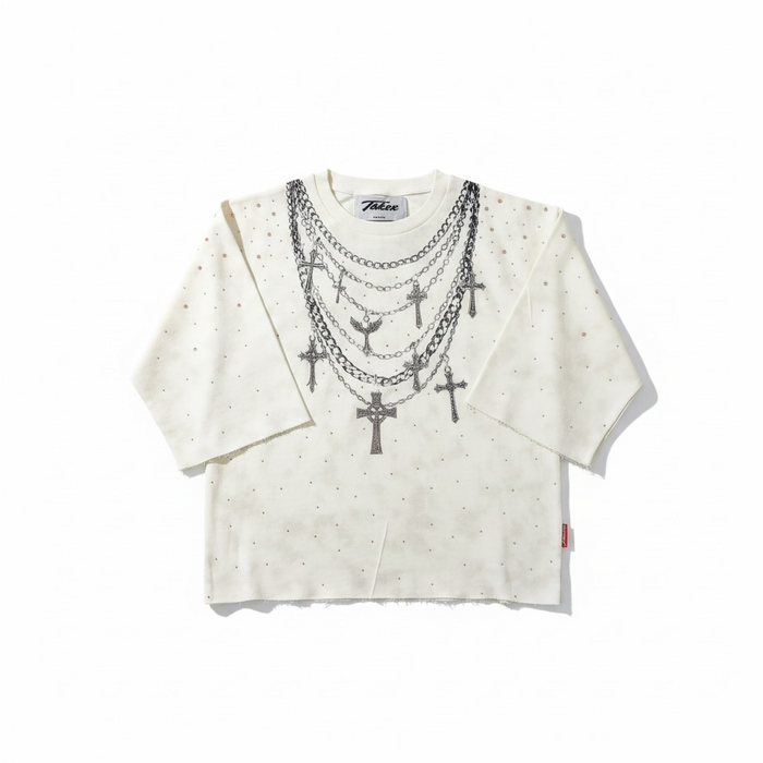 Cream Taker T5224 Rise and Grind raw edge rhinestone cropped tee displayed on a hanger with visible raw edges and rhinestone details.