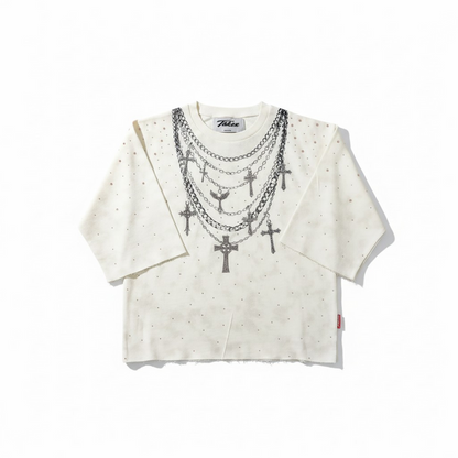 Cream Taker T5224 Rise and Grind raw edge rhinestone cropped tee displayed on a hanger with visible raw edges and rhinestone details.