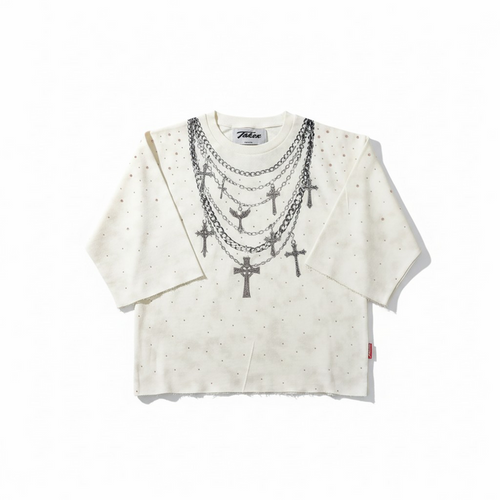 Cream Taker T5224 Rise and Grind raw edge rhinestone cropped tee displayed on a hanger with visible raw edges and rhinestone details.