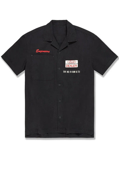 Black Jordan Craig The Re-Up Mechanic Button Up Shirt displayed on a mannequin, showcasing a classic design and tailored fit.
