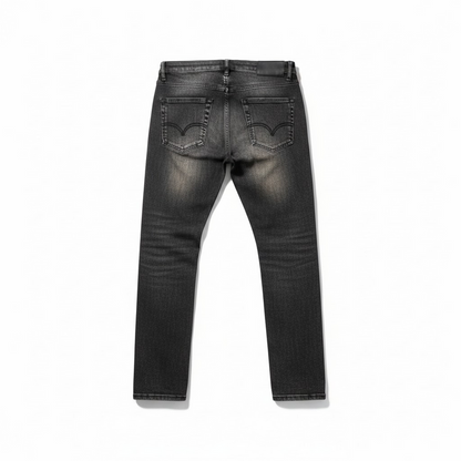 Black wash Waimea 'Padded Rips' slim fit denim jeans, showcasing distressed rips and padded details on a natural fit.